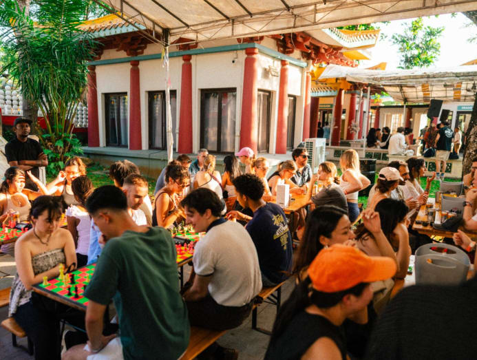 Party attendees playing chess