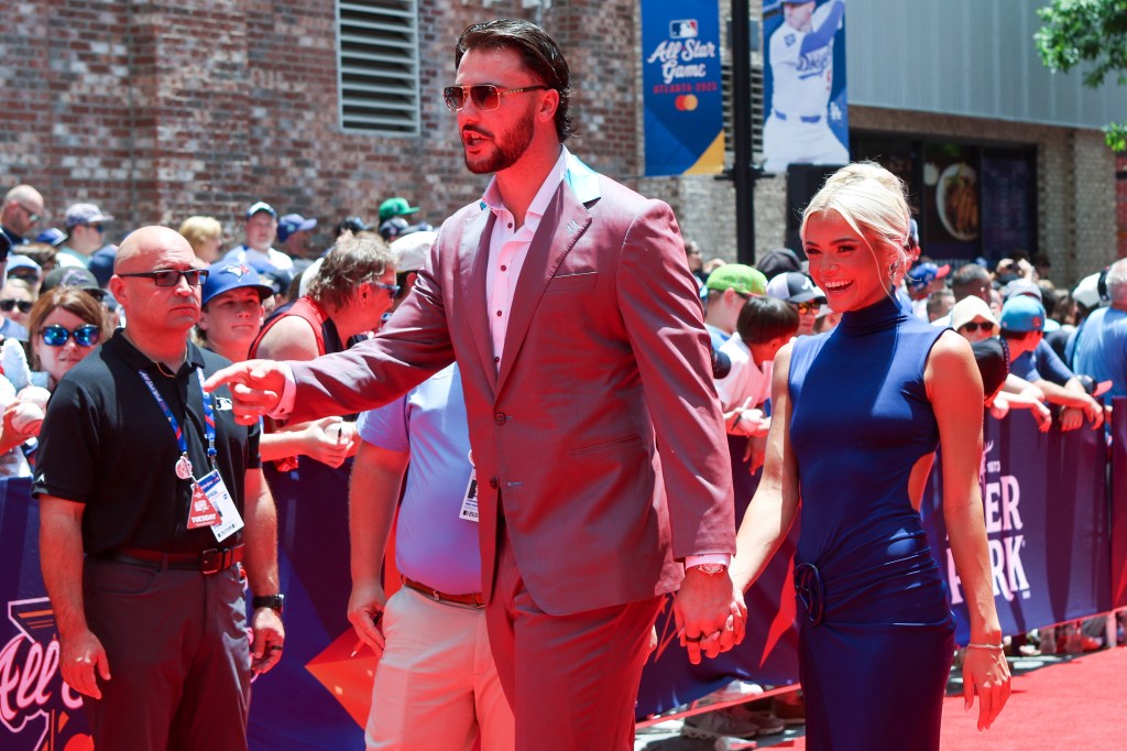 Paul Skenes and Livvy Dunne holding hands at the 2025 MLB All-Star Game.