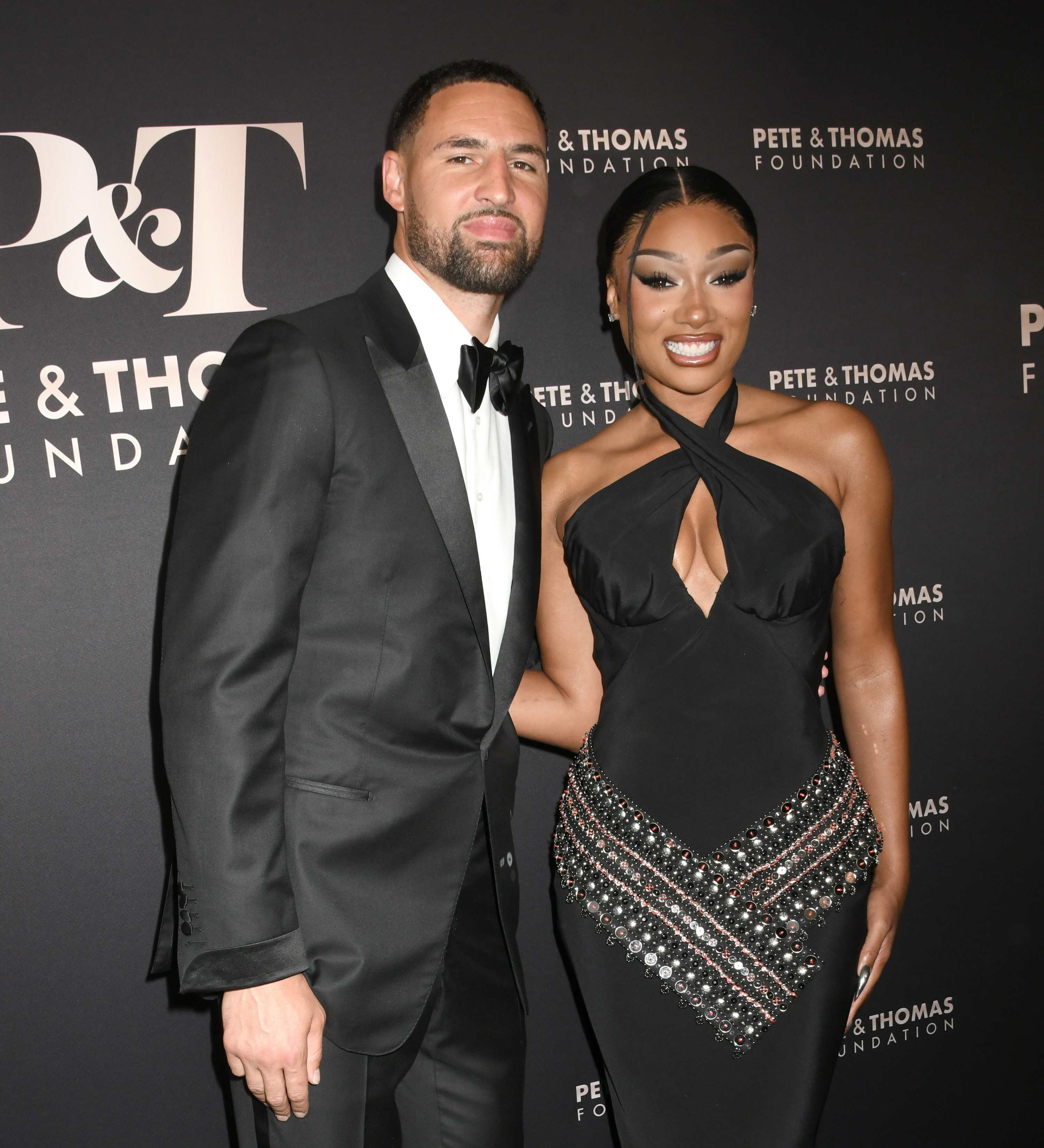 Klay Thompson and Megan Thee Stallion looking affectionate