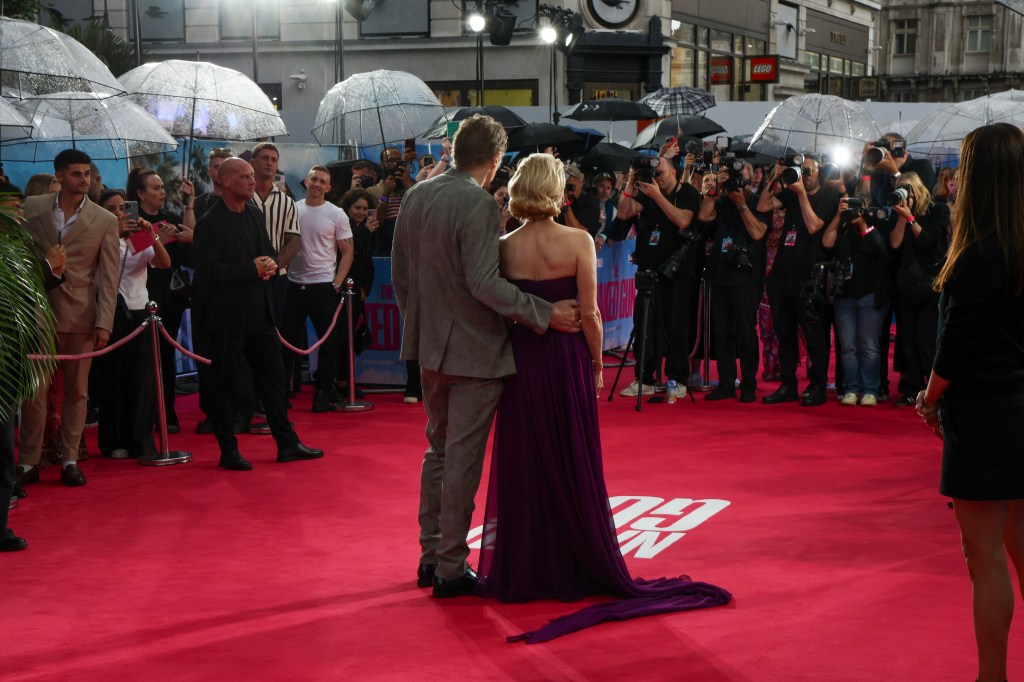 Liam Neeson and Pamela Anderson enjoying the premiere event.