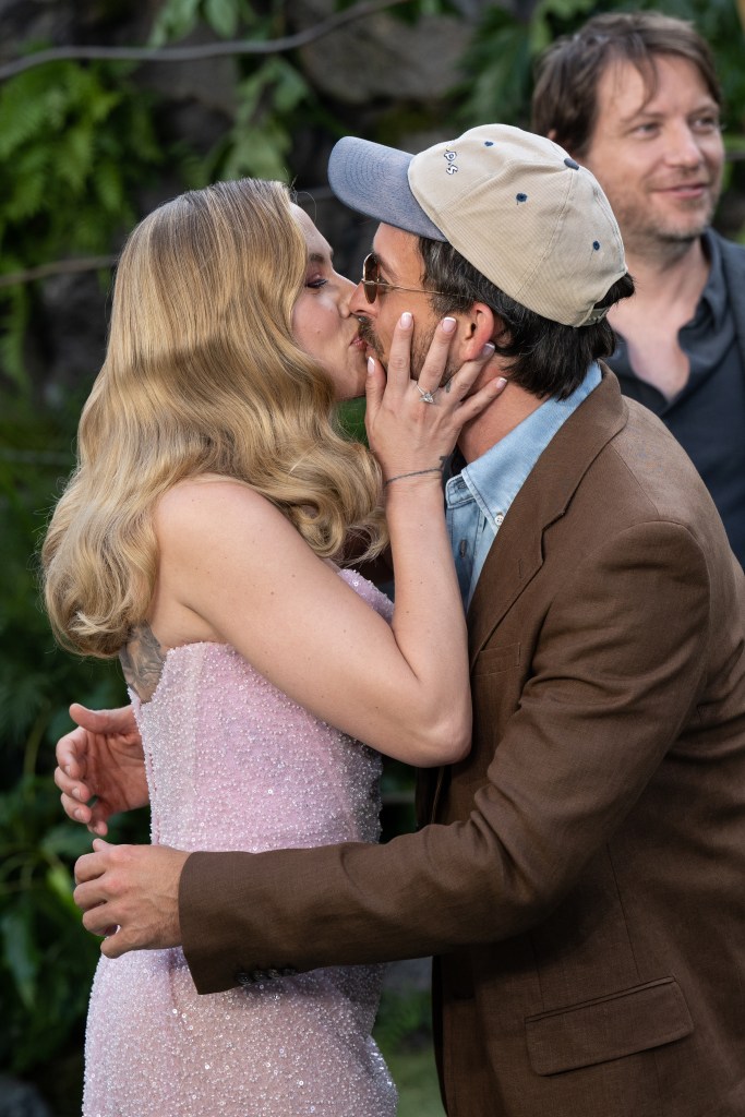Scarlett Johansson and Jonathan Bailey sharing a kiss