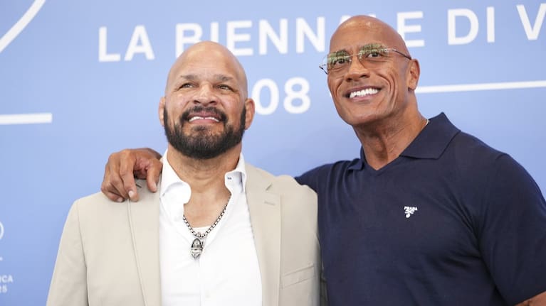 Mark Kerr and Dwayne Johnson pose for photographers at the Venice Film Festival.