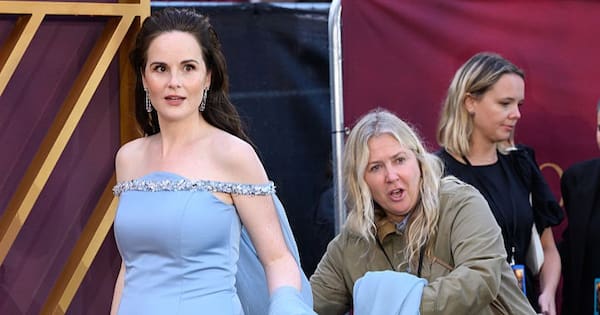 Downton Abbey Star Unveils Pregnancy in Stunning Prada Ensemble