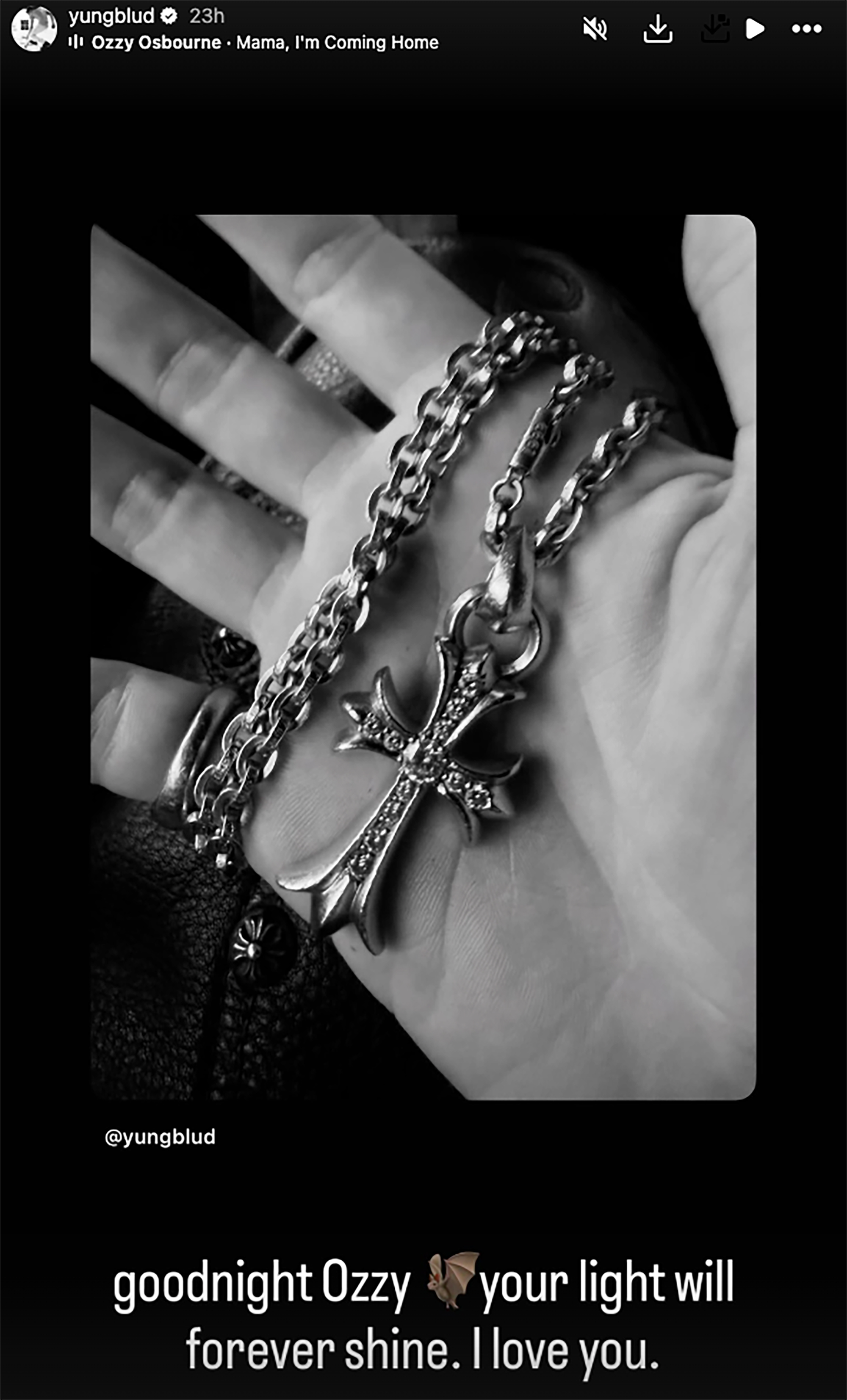 A close-up of the cross necklace gifted by Ozzy Osbourne.