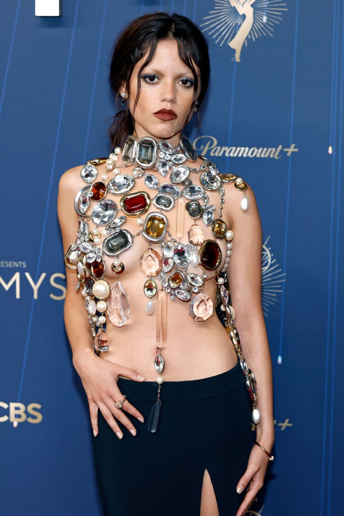 Jenna Ortega attending the 2025 Emmy Awards in a jeweled outfit.