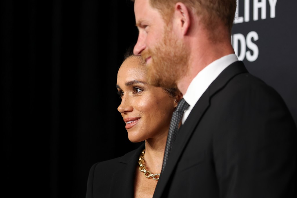 Harry speaking as Markle stands beside him during their speech at the gala.