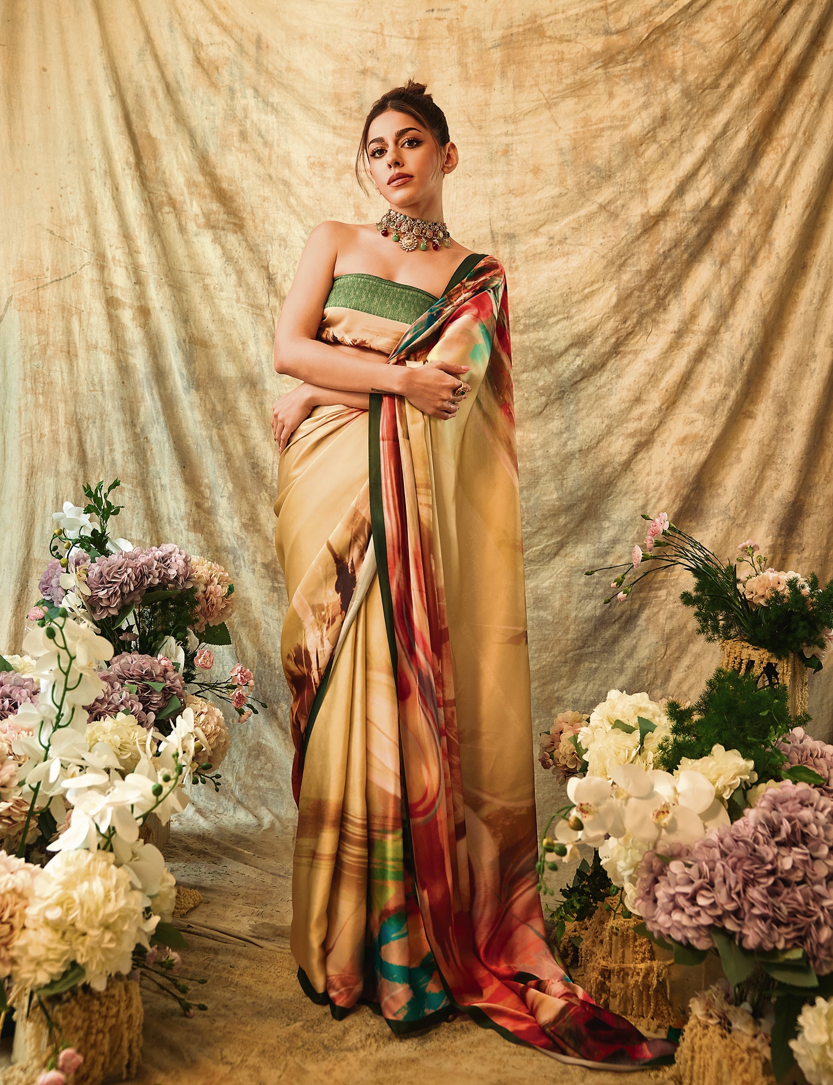 Alaya F glowing in a vibrant yellow sari by Libas