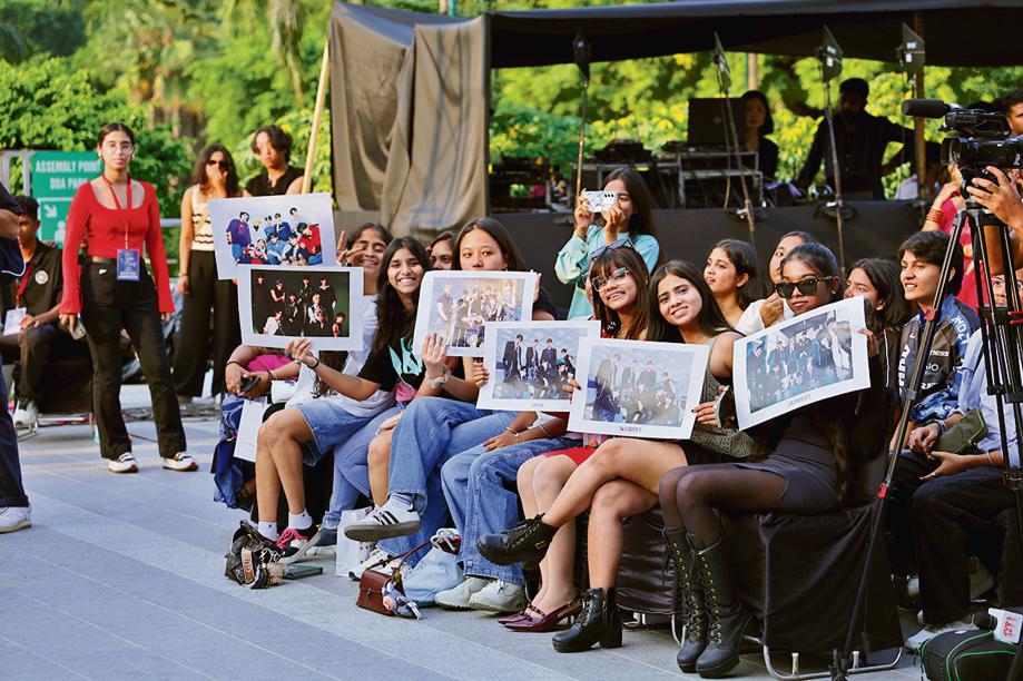 Fans cheering for YOUNITE at the festival.
