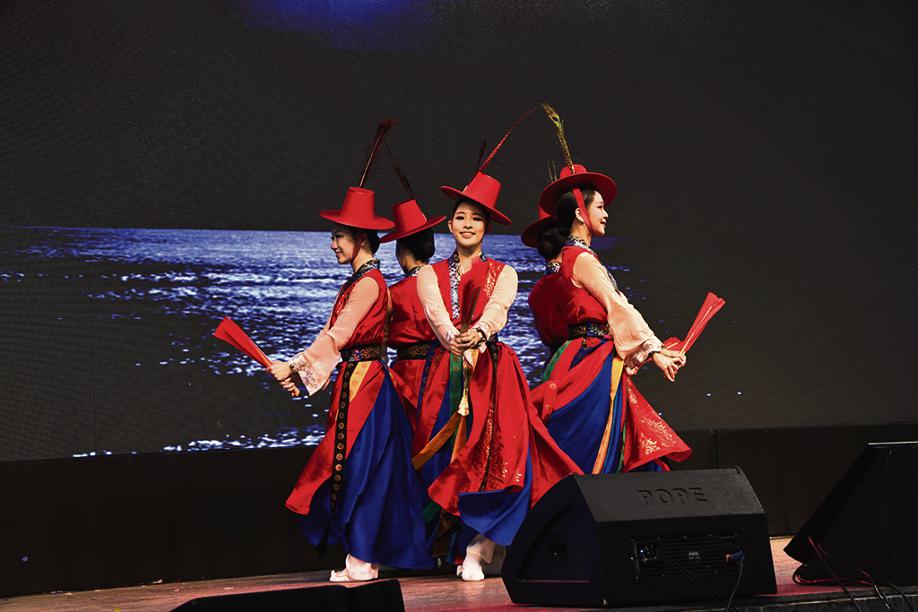 Korean dance troupe performing traditional moves.