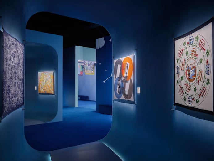 Gallery featuring silk scarves showcased in the animated film.
