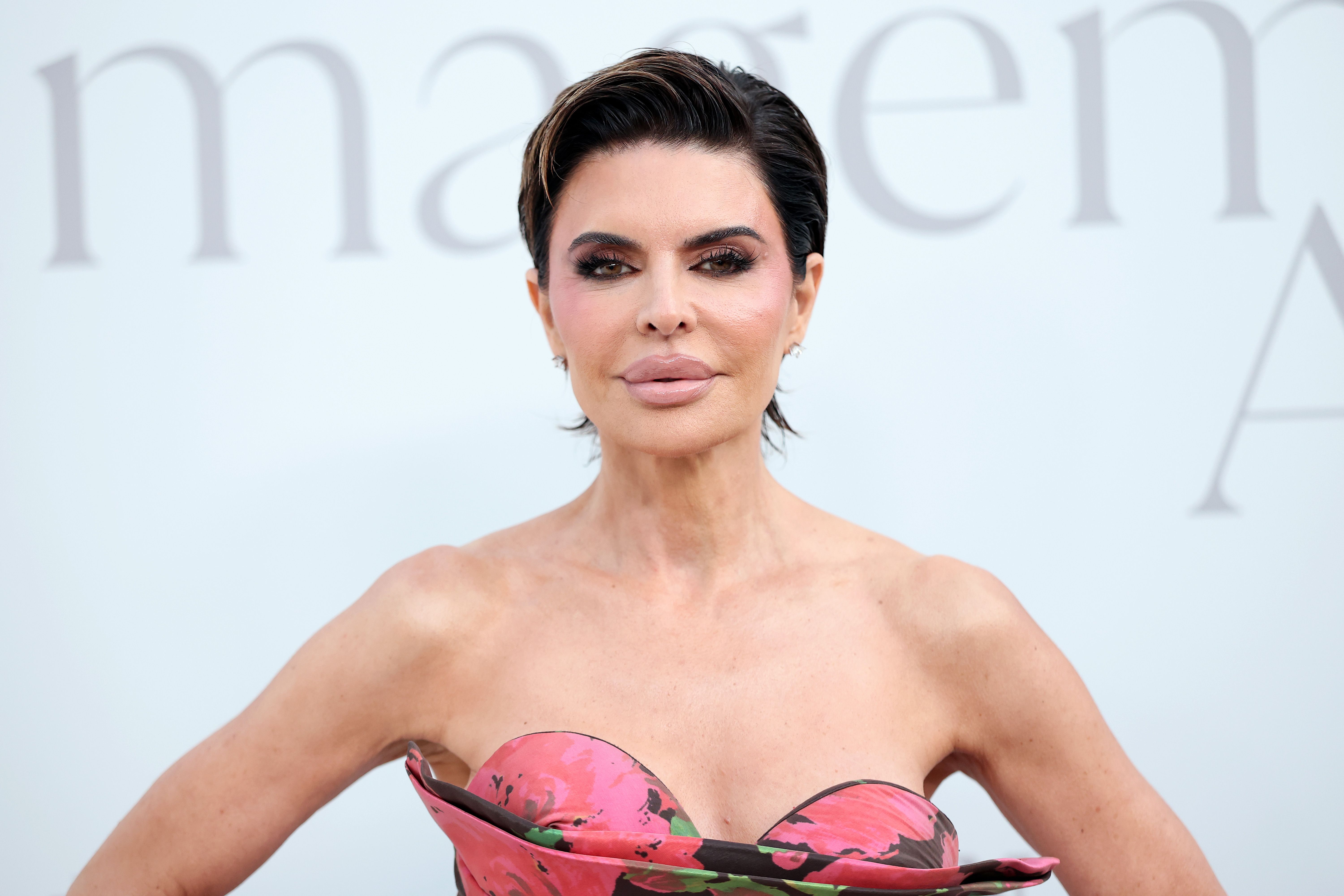 Lisa Rinna shining at the InStyle Imagemaker Awards 2025, wearing a captivating floral gown.