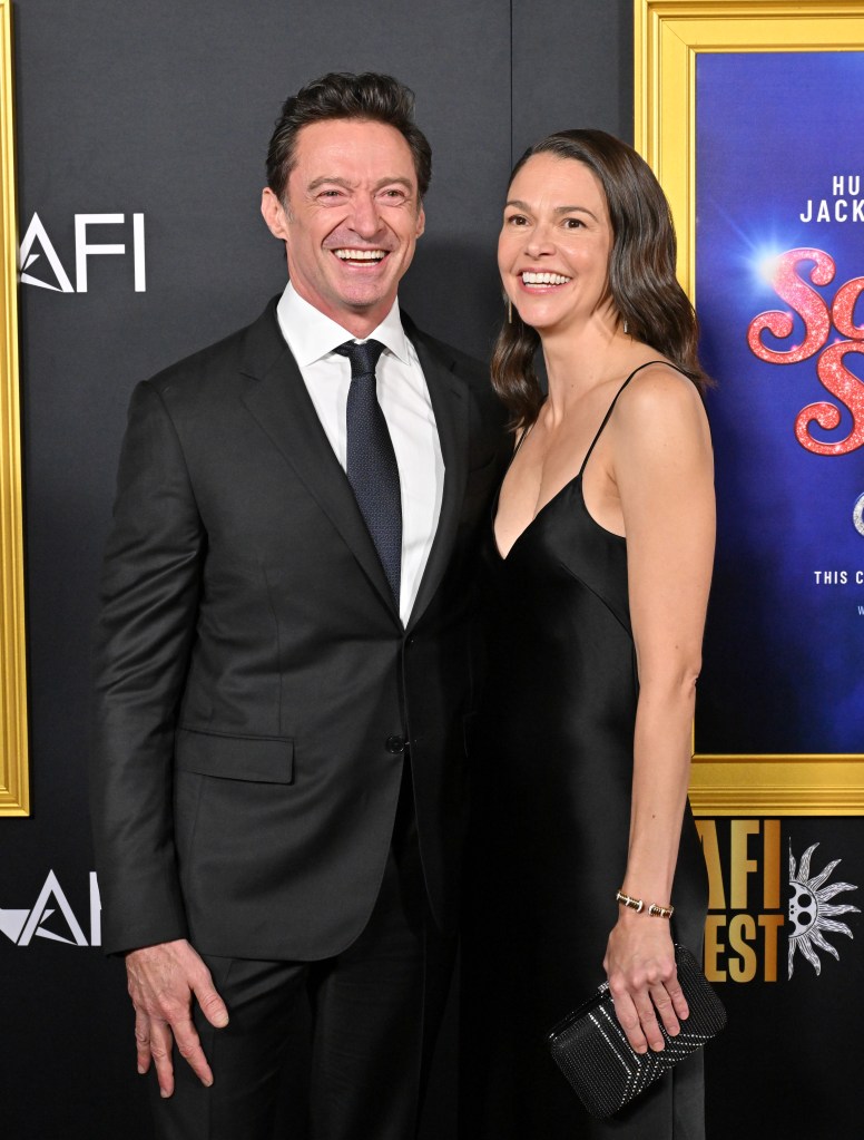 Hugh Jackman and Sutton Foster smiling at the 'Song Sung Blue' premiere.